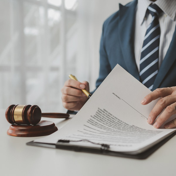 Home close up of lawyer signing papers